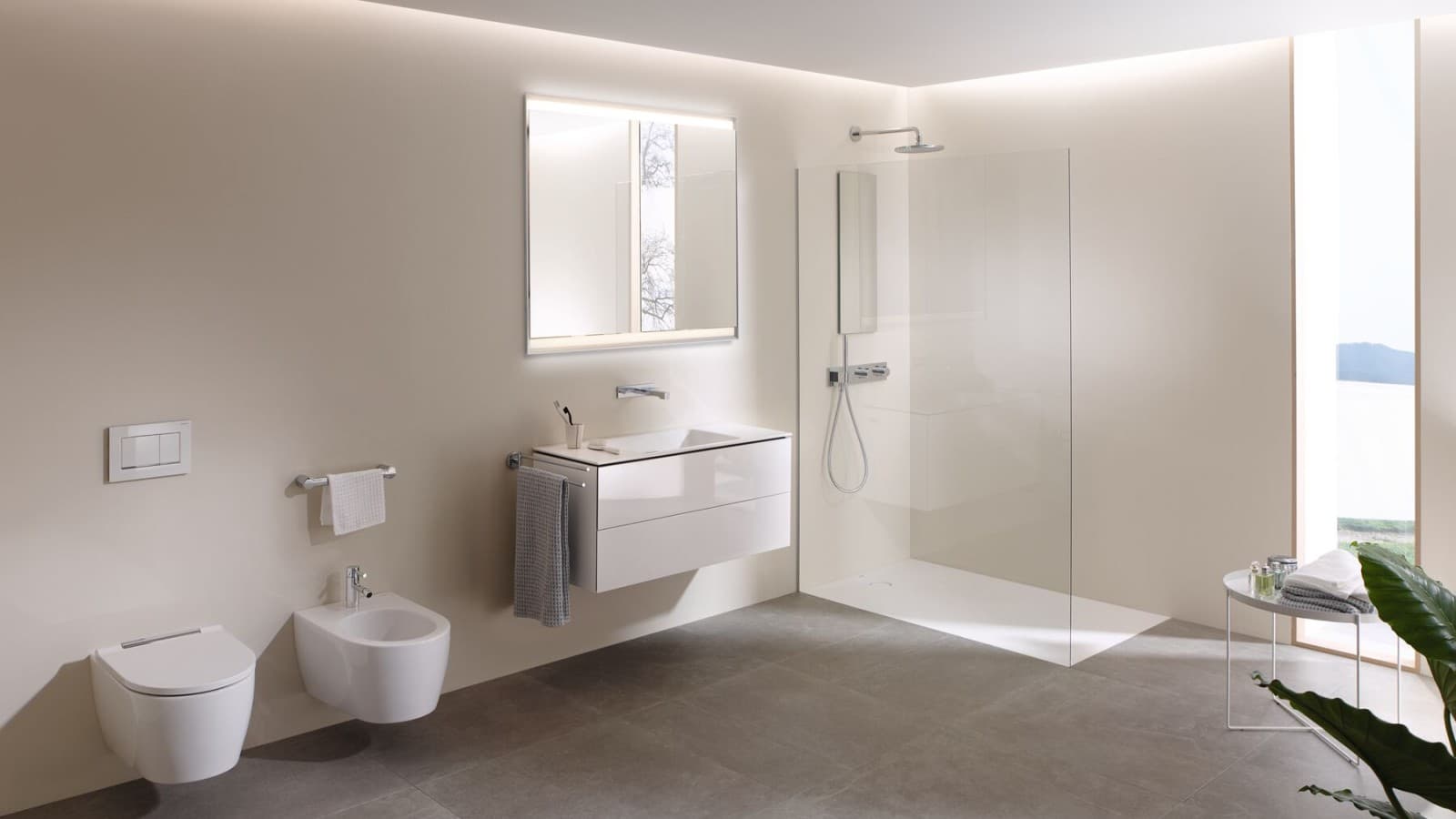 Una mirada al interior de un baño grande con inodoro bidé Geberit AquaClean Mera y muebles de calidad (© Geberit) Una mirada al interior de un baño grande con inodoro bidé Geberit AquaClean Mera y muebles de calidad (© Geberit)