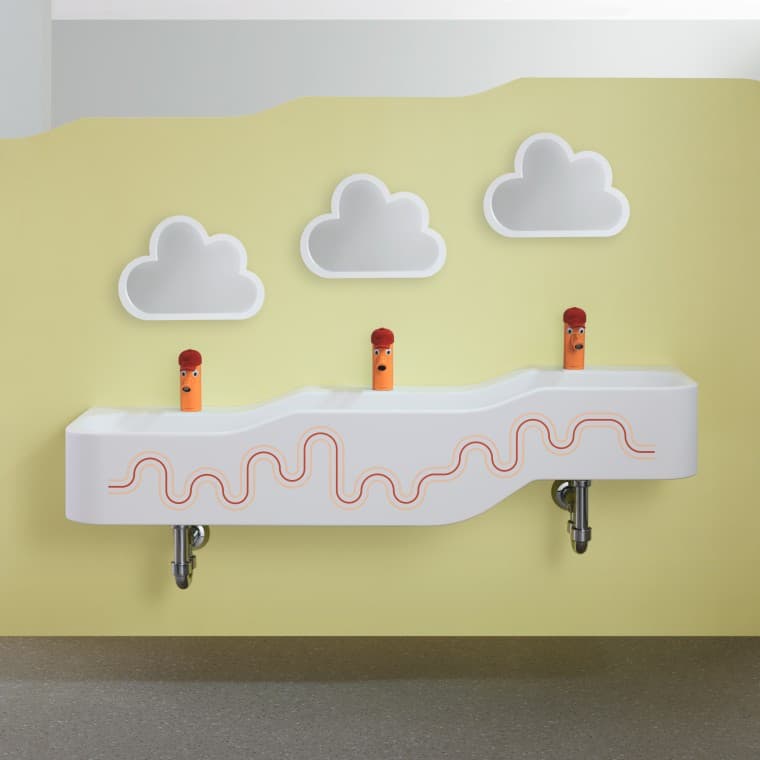 Espacio para jugar y lavarse Geberit Bambini en rojo carmín y naranja Espacio para jugar y lavarse Geberit Bambini en rojo carmín y naranja