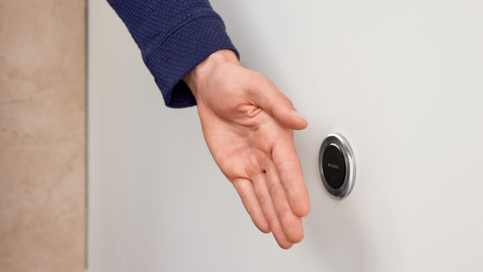 Pulsador a distancia Geberit serie 10 por infrarrojos, redondo, con mano Pulsador a distancia Geberit serie 10 por infrarrojos, redondo, con mano